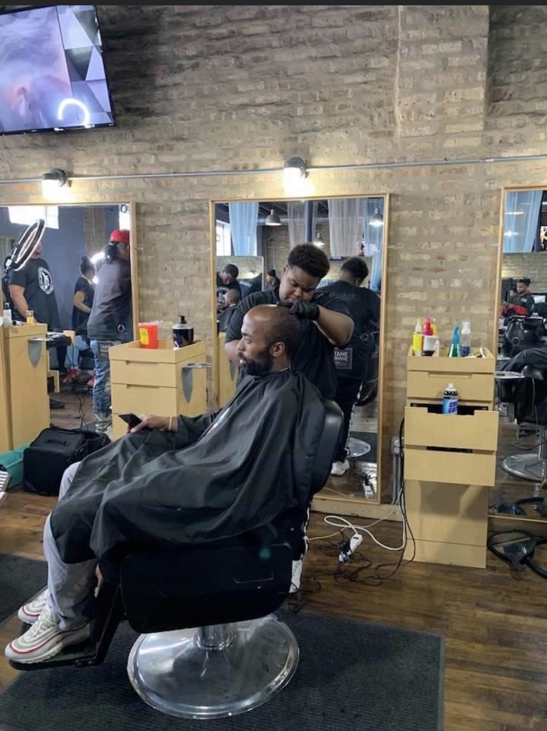 Students training at Networks Barber College